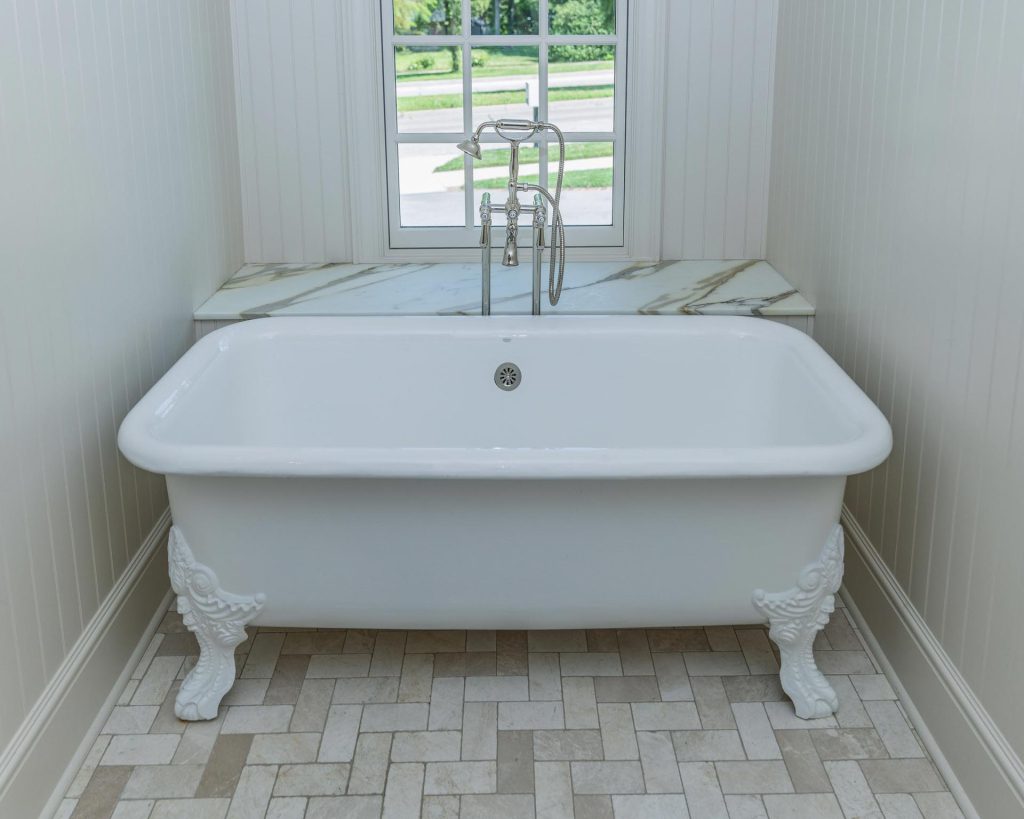 Restored antique clawfoot bathtub in a remodeled bathroom in Lawrence, Kansas