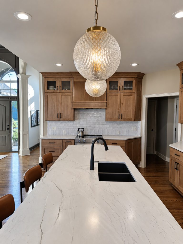 Kitchen island with new pendant lighting after a Kansas City kitchen remodel